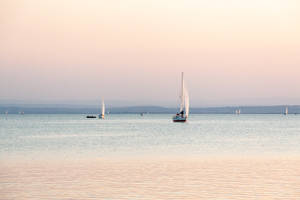 Sailboats On Austria Beach Wallpaper