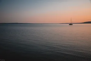 Sailing Alone In Calm Waters Wallpaper