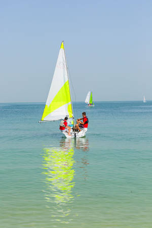 Sailing Boat On Shallow Sea Wallpaper