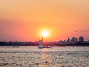 Sailing On City Sunset Wallpaper