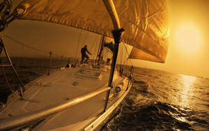 Sailing While Fixing Sails Wallpaper