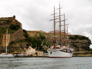 Sailing Yacht Near Limestone Cliff Wallpaper