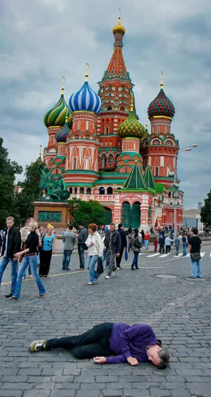 Saint Basil's Cathedral With Man Lying On The Ground Wallpaper