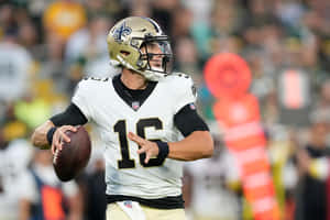 Saints Quarterback Ian Book In Action Wallpaper