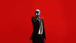 Sakamoto Days Character Gun Pointing Red Background Wallpaper
