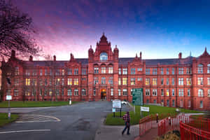 Salford University Peacock Buildingat Dusk Wallpaper