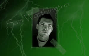Sam Worthington Green Background Photo Wallpaper