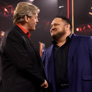 Samoa Joe Smiling To William Regal Wwe Wallpaper