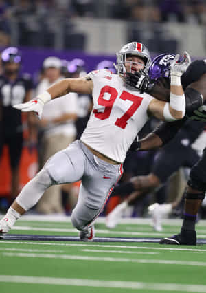 San Francisco 49er Defensive End Nick Bosa Poses With New Jersey. Wallpaper