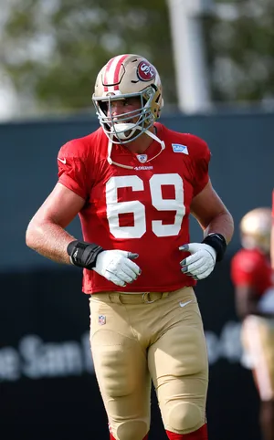 San Francisco 49ers Offensive Lineman Mike Mcglinchey In Action Wallpaper