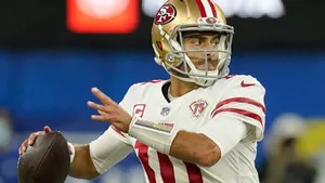 San Francisco 49ers Quarterback Jimmy Garoppolo In Action Wallpaper