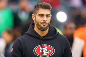 San Francisco 49ers Quarterback Jimmy Garoppolo In Action Wallpaper