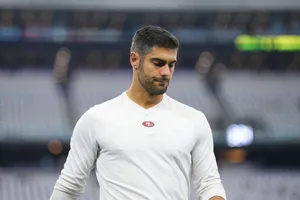San Francisco 49ers Quarterback Jimmy Garoppolo In Action Wallpaper