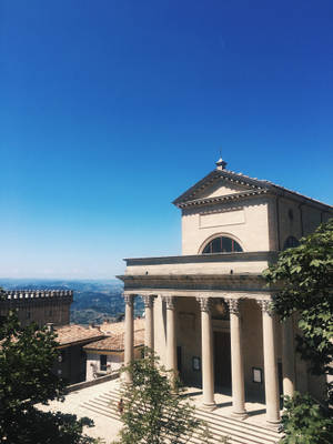 San Marino Basilica Del Santo Under A Vibrant Sky Wallpaper