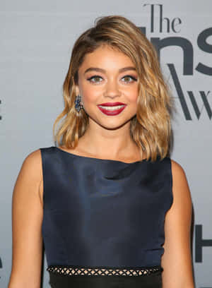 Sarah Hyland Looking Stunning In A White Dress At An Event Wallpaper