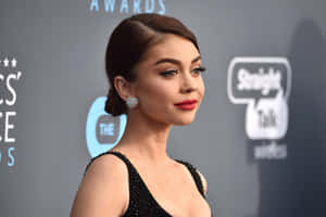 Sarah Hyland Posing Elegantly In A Photo Session Wallpaper