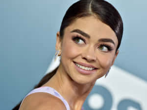 Sarah Hyland Radiant In Red Wallpaper