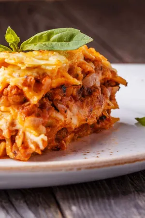 Satisfying Slice Of Authentic Lasagna Alla Bolognese Wallpaper