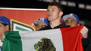 Saul Canelo Alvarez Proudly Holding The Flag Of His Homeland Wallpaper