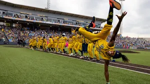 Savannah Bananas Player Flippingon Field Wallpaper