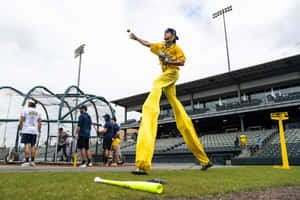 Savannah Bananas Player Stilt Catch Practice.jpg Wallpaper