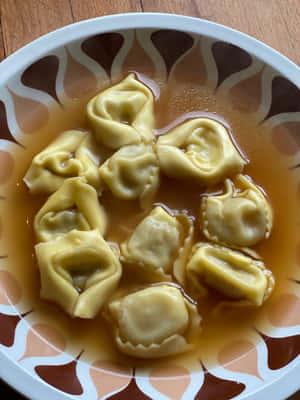 Savory Home-cooked Tortellini In Brodo Wallpaper