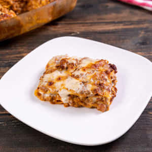 Savory Lasagna Alla Bolognese Ready For Serving Wallpaper