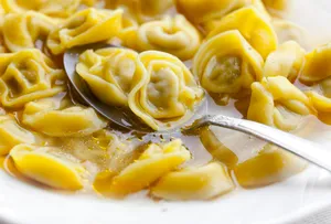 Savory Spoonful Of Tortellini In Brodo Wallpaper