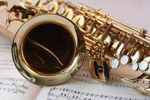 Saxophone On Sheet Music 4k Wallpaper