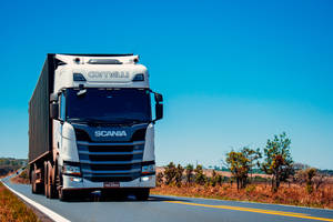 Scania Trailer Truck At Road Wallpaper