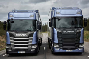 Scania Trucks Sideby Sideon Road Wallpaper