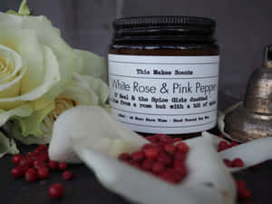 Scattered Pink Peppercorns On A Surface Wallpaper