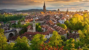 Scenic View Of Bern Cityscape And Swiss Alps Wallpaper