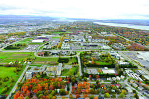 Scenic View Of Laval Cityscape During A Vibrant Sunset Wallpaper