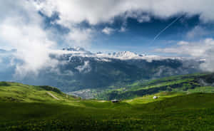 Scenic View Of Spring Mountain With Blooming Flowers And Lush Greenery. Wallpaper