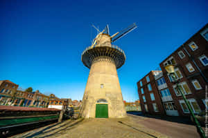 Schiedam Windmill Against Blue Sky Wallpaper