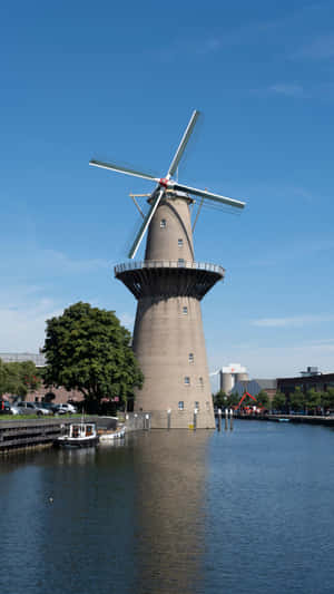 Schiedam Windmill By Water Wallpaper