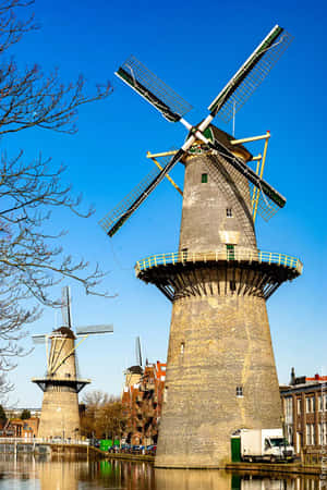 Schiedam Windmills Along Canal Wallpaper