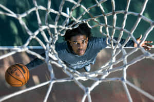 Scoot Henderson Showing Off His Breathtaking Basketball Skills Wallpaper