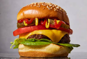 Scrumptious Cheeseburger Fresh From The Grill Wallpaper