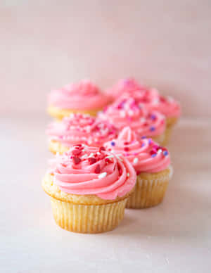 Scrumptious Pink Cupcakes Wallpaper