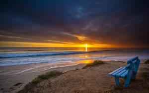 Seaside Bench At Sunset Wallpaper