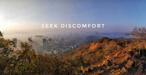 Seek Comfort - A City With Mountains And A City Wallpaper