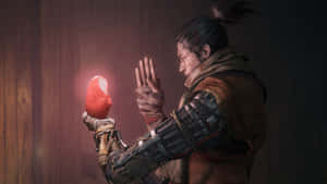 Sekiro Holding Resurrection Orb4 K Wallpaper