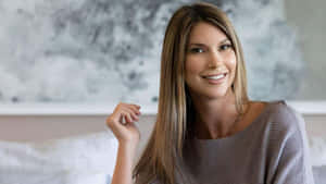 Selling Sunset Star Smiling Confidently Wallpaper