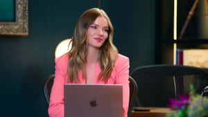 Selling Sunset Star Working On Laptop Wallpaper