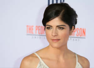 Selma Blair Posing In An Elegant Outfit, Smiling Charmingly For The Camera Wallpaper