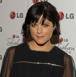 Selma Blair Wearing A Beautiful Black Dress With A White Background Wallpaper