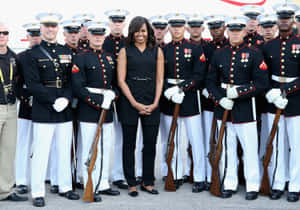 Semper Fi - A U.s. Marine Salutes The American Flag Wallpaper