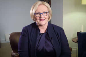Senator Claire Mccaskill Sitting On An Armchair Wallpaper